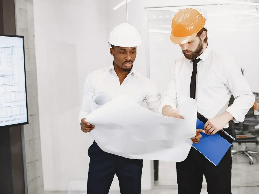 Architects reviewing plans together