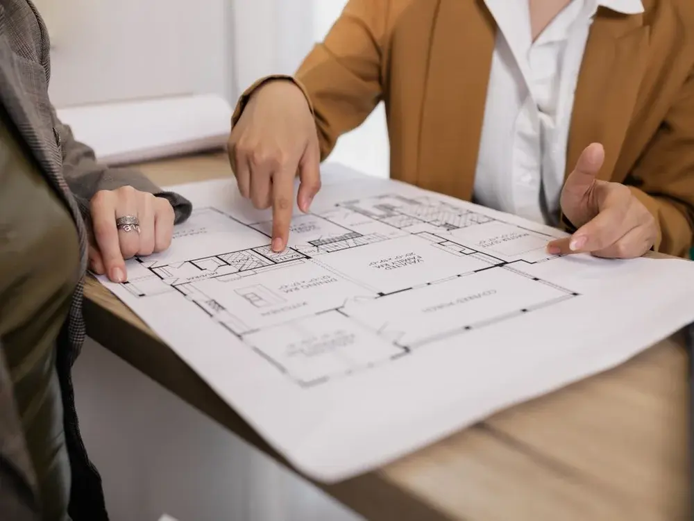 Project team discussing architectural plans