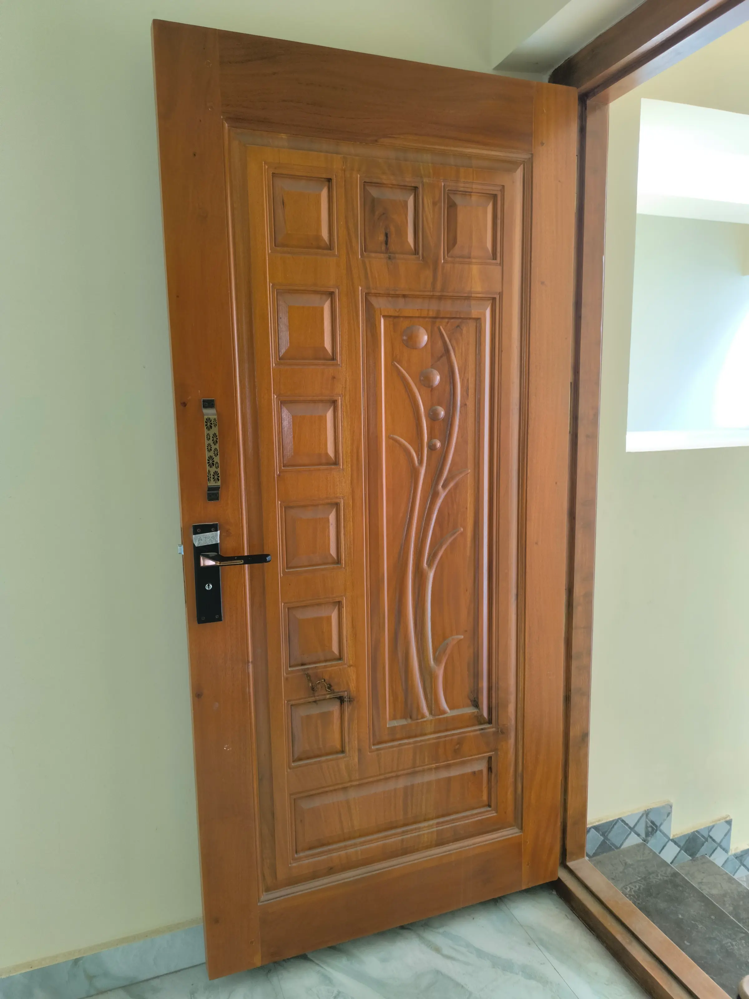 Completed residential home: carved wooden entrance door